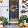 Artificial autumn wreath, decorated with lamb's ear leaves, eucalyptus leaves, and berries, suitable for indoor and outdoor farmhouse-style home wall